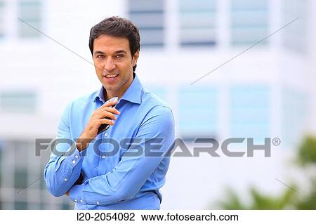 Businessman with smartphone business center. San Sebastian Technology Park. Donostia. Gipuzkoa. Basque Country. Spain. View Large Photo Image Stock Image - Businessman with smartphone business center. San Sebastian Technology Park. Donostia. Gipuzkoa. Basque Country. Spain.. Fotosearch