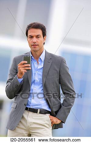 Businessman with smartphone business center. San Sebastian Technology Park. Donostia. Gipuzkoa. Basque Country. Spain. View Large Photo Image Stock Image - Businessman with smartphone business center. San Sebastian Technology Park. Donostia. Gipuzkoa. Basque Country. Spain.. Fotosearch