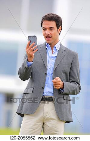 Businessman with smartphone business center. San Sebastian Technology Park. Donostia. Gipuzkoa. Basque Country. Spain. View Large Photo Image Stock Image - Businessman with smartphone business center. San Sebastian Technology Park. Donostia. Gipuzkoa. Basque Country. Spain.. Fotosearch
