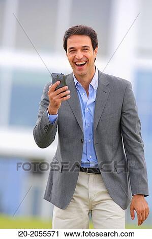 Businessman with smartphone business center. San Sebastian Technology Park. Donostia. Gipuzkoa. Basque Country. Spain. View Large Photo Image Stock Image - Businessman with smartphone business center. San Sebastian Technology Park. Donostia. Gipuzkoa. Basque Country. Spain.. Fotosearch