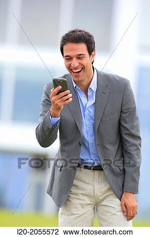Businessman with smartphone business center. San Sebastian Technology Park. Donostia. Gipuzkoa. Basque Country. Spain. View Large Photo Image Stock Image - Businessman with smartphone business center. San Sebastian Technology Park. Donostia. Gipuzkoa. Basque Country. Spain.. Fotosearch