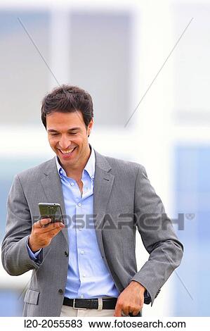 Businessman with smartphone business center. San Sebastian Technology Park. Donostia. Gipuzkoa. Basque Country. Spain. View Large Photo Image Stock Image - Businessman with smartphone business center. San Sebastian Technology Park. Donostia. Gipuzkoa. Basque Country. Spain.. Fotosearch