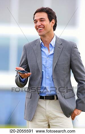Stock Image - Businessman with smartphone business center. San Sebastian Technology Park. Donostia. Gipuzkoa. Basque Country. Spain.. Fotosearch
