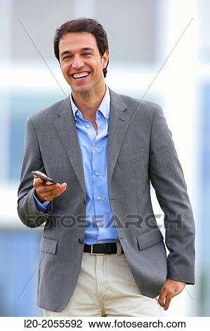 Businessman with smartphone business center. San Sebastian Technology Park. Donostia. Gipuzkoa. Basque Country. Spain. View Large Photo Image Stock Image - Businessman with smartphone business center. San Sebastian Technology Park. Donostia. Gipuzkoa. Basque Country. Spain.. Fotosearch