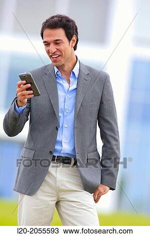 Businessman with smartphone business center. San Sebastian Technology Park. Donostia. Gipuzkoa. Basque Country. Spain. View Large Photo Image Stock Image - Businessman with smartphone business center. San Sebastian Technology Park. Donostia. Gipuzkoa. Basque Country. Spain.. Fotosearch