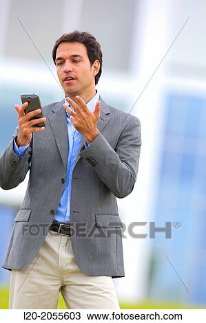 Businessman with smartphone business center. San Sebastian Technology Park. Donostia. Gipuzkoa. Basque Country. Spain. View Large Photo Image Stock Image - Businessman with smartphone business center. San Sebastian Technology Park. Donostia. Gipuzkoa. Basque Country. Spain.. Fotosearch