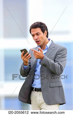 Businessman with smartphone business center. San Sebastian Technology Park. Donostia. Gipuzkoa. Basque Country. Spain. View Large Photo Image Stock Image - Businessman with smartphone business center. San Sebastian Technology Park. Donostia. Gipuzkoa. Basque Country. Spain.. Fotosearch