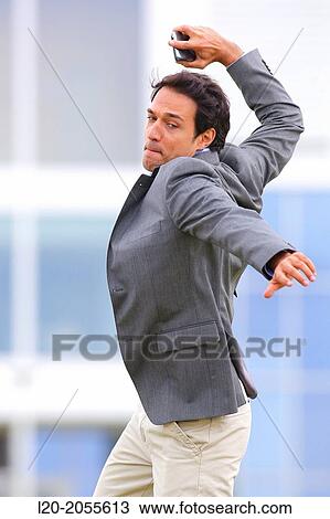 Stock Image - Businessman with smartphone business center. San Sebastian Technology Park. Donostia. Gipuzkoa. Basque Country. Spain.. Fotosearch