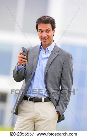 Businessman with smartphone business center. San Sebastian Technology Park. Donostia. Gipuzkoa. Basque Country. Spain. View Large Photo Image Stock Photo - Businessman with smartphone business center. San Sebastian Technology Park. Donostia. Gipuzkoa. Basque Country. Spain.. Fotosearch