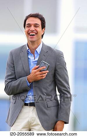 Businessman with smartphone business center. San Sebastian Technology Park. Donostia. Gipuzkoa. Basque Country. Spain. View Large Photo Image Stock Photo - Businessman with smartphone business center. San Sebastian Technology Park. Donostia. Gipuzkoa. Basque Country. Spain.. Fotosearch