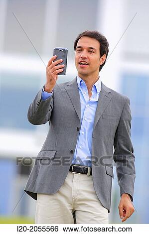 Businessman with smartphone business center. San Sebastian Technology Park. Donostia. Gipuzkoa. Basque Country. Spain. View Large Photo Image Stock Photograph - Businessman with smartphone business center. San Sebastian Technology Park. Donostia. Gipuzkoa. Basque Country. Spain.. Fotosearch