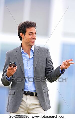 Businessman with smartphone business center. San Sebastian Technology Park. Donostia. Gipuzkoa. Basque Country. Spain. View Large Photo Image Stock Photograph - Businessman with smartphone business center. San Sebastian Technology Park. Donostia. Gipuzkoa. Basque Country. Spain.. Fotosearch