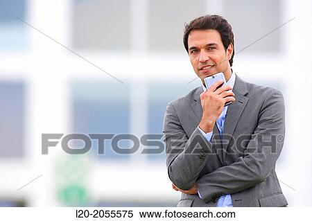 Businessman with smartphone business center. San Sebastian Technology Park. Donostia. Gipuzkoa. Basque Country. Spain. View Large Photo Image Stock Photography - Businessman with smartphone business center. San Sebastian Technology Park. Donostia. Gipuzkoa. Basque Country. Spain.. Fotosearch