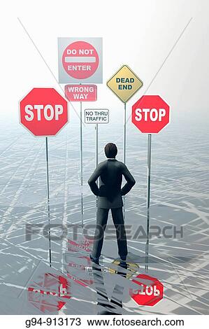 Stock Image - Businessman with stop signs. Fotosearch
