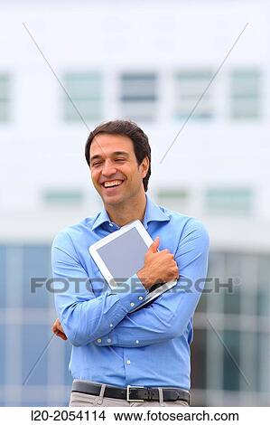 Businessman with tablet in business center. San Sebastian Technology Park. Donostia. Gipuzkoa. Basque Country. Spain. View Large Photo Image Picture - Businessman with tablet in business center. San Sebastian Technology Park. Donostia. Gipuzkoa. Basque Country. Spain.. Fotosearch