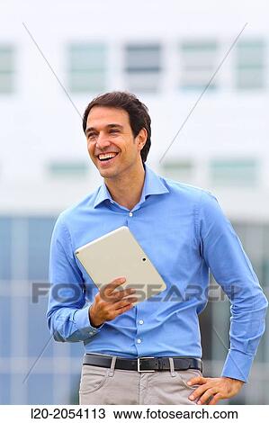 Businessman with tablet in business center. San Sebastian Technology Park. Donostia. Gipuzkoa. Basque Country. Spain. View Large Photo Image Stock Image - Businessman with tablet in business center. San Sebastian Technology Park. Donostia. Gipuzkoa. Basque Country. Spain.. Fotosearch