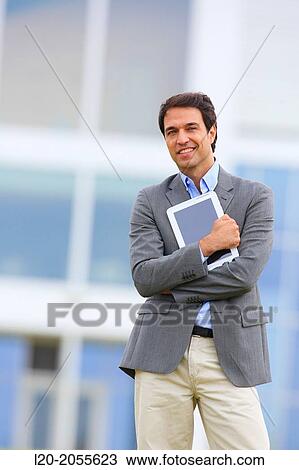 Businessman with tablet in business center. San Sebastian Technology Park. Donostia. Gipuzkoa. Basque Country. Spain. View Large Photo Image Stock Image - Businessman with tablet in business center. San Sebastian Technology Park. Donostia. Gipuzkoa. Basque Country. Spain.. Fotosearch