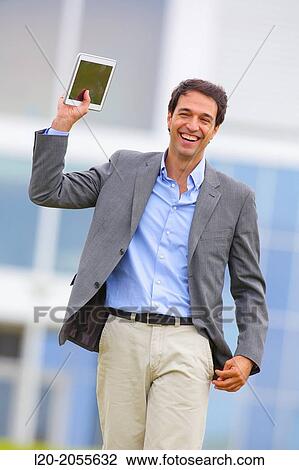 Stock Image - Businessman with tablet in business center. San Sebastian Technology Park. Donostia. Gipuzkoa. Basque Country. Spain.. Fotosearch