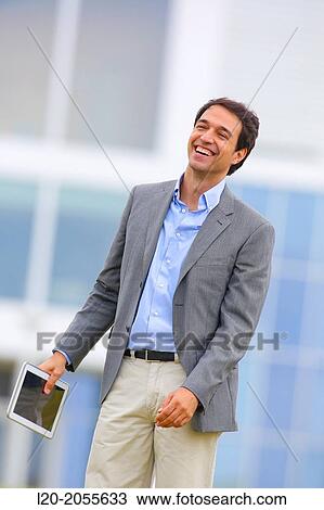 Stock Image - Businessman with tablet in business center. San Sebastian Technology Park. Donostia. Gipuzkoa. Basque Country. Spain.. Fotosearch