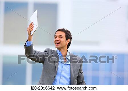 Businessman with tablet in business center. San Sebastian Technology Park. Donostia. Gipuzkoa. Basque Country. Spain. View Large Photo Image Stock Image - Businessman with tablet in business center. San Sebastian Technology Park. Donostia. Gipuzkoa. Basque Country. Spain.. Fotosearch