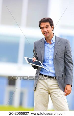 Stock Photo - Businessman with tablet in business center. San Sebastian Technology Park. Donostia. Gipuzkoa. Basque Country. Spain.. Fotosearch