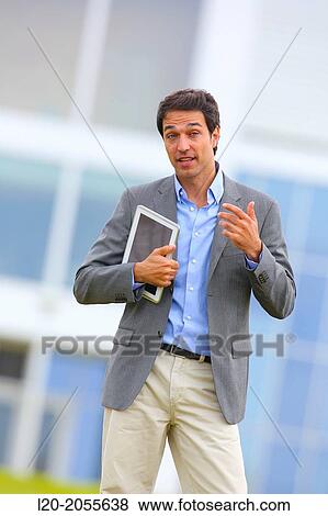 Stock Photo - Businessman with tablet in business center. San Sebastian Technology Park. Donostia. Gipuzkoa. Basque Country. Spain.. Fotosearch