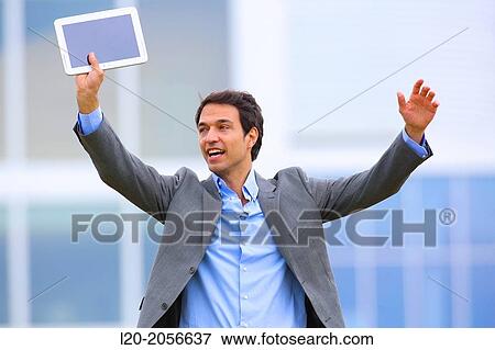 Businessman with tablet in business center. San Sebastian Technology Park. Donostia. Gipuzkoa. Basque Country. Spain. View Large Photo Image Stock Photo - Businessman with tablet in business center. San Sebastian Technology Park. Donostia. Gipuzkoa. Basque Country. Spain.. Fotosearch