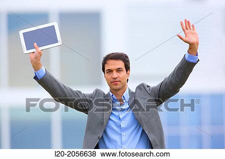 Businessman with tablet in business center. San Sebastian Technology Park. Donostia. Gipuzkoa. Basque Country. Spain. View Large Photo Image Stock Photo - Businessman with tablet in business center. San Sebastian Technology Park. Donostia. Gipuzkoa. Basque Country. Spain.. Fotosearch