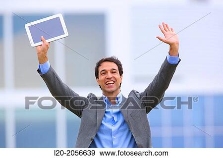 Stock Photo - Businessman with tablet in business center. San Sebastian Technology Park. Donostia. Gipuzkoa. Basque Country. Spain.. Fotosearch