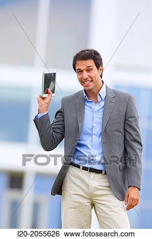Stock Photograph - Businessman with tablet in business center. San Sebastian Technology Park. Donostia. Gipuzkoa. Basque Country. Spain.. Fotosearch