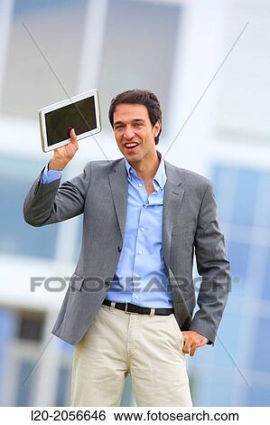 Businessman with tablet in business center. San Sebastian Technology Park. Donostia. Gipuzkoa. Basque Country. Spain. View Large Photo Image Stock Photograph - Businessman with tablet in business center. San Sebastian Technology Park. Donostia. Gipuzkoa. Basque Country. Spain.. Fotosearch