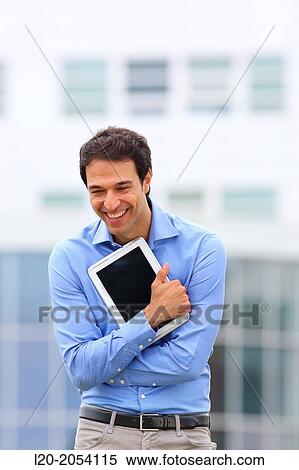 Stock Photography - Businessman with tablet in business center. San Sebastian Technology Park. Donostia. Gipuzkoa. Basque Country. Spain.. Fotosearch