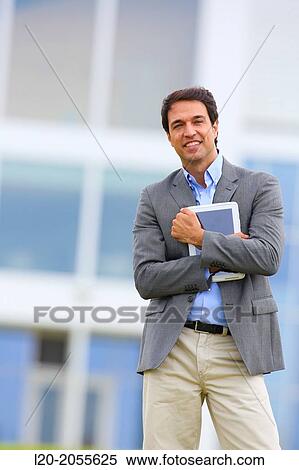 Businessman with tablet in business center. San Sebastian Technology Park. Donostia. Gipuzkoa. Basque Country. Spain. View Large Photo Image Stock Photography - Businessman with tablet in business center. San Sebastian Technology Park. Donostia. Gipuzkoa. Basque Country. Spain.. Fotosearch