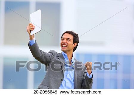 Businessman with tablet in business center. San Sebastian Technology Park. Donostia. Gipuzkoa. Basque Country. Spain. View Large Photo Image Stock Photography - Businessman with tablet in business center. San Sebastian Technology Park. Donostia. Gipuzkoa. Basque Country. Spain.. Fotosearch