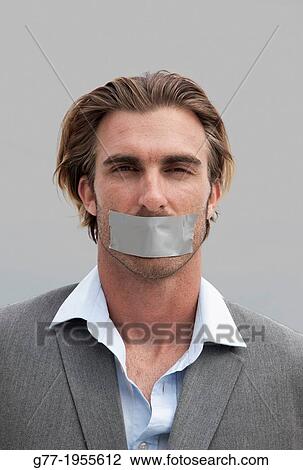 Businessman with tape on his mouth Miami, USA View Large Photo Image Stock Image - Businessman with tape on his mouth Miami, USA. Fotosearch