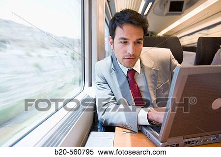 Stock Photography - Businessman working connected to the internet. Passenger. AVE, Tren de Alta Velocidad, Zaragoza, Arag? n. Spain.. Fotosearch