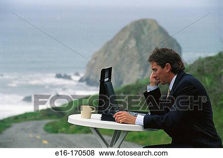 Stock Photo - Businessman working outdoors. Fotosearch