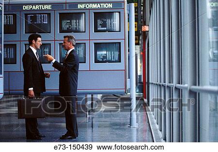 Businessmen at the airport View Large Photo Image Stock Photo - Businessmen at the airport. Fotosearch