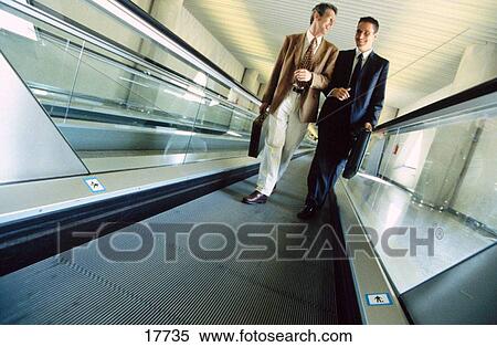 Businessmen at the airport View Large Photo Image Stock Photography - Businessmen at the airport. Fotosearch