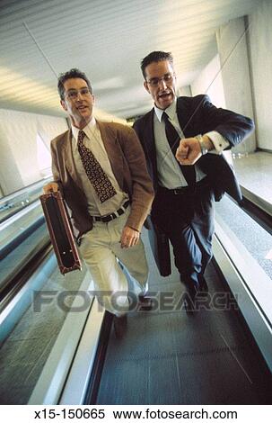 Businessmen at the airport View Large Photo Image Stock Photography - Businessmen at the airport. Fotosearch