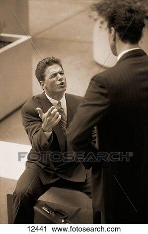 Businessmen discussing View Large Photo Image Stock Image - Businessmen discussing. Fotosearch