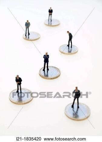 Businessmen figurines over euro coins. View Large Photo Image Stock Image - Businessmen figurines over euro coins.. Fotosearch