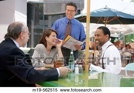 Stock Photography - businessmen having lunch. Fotosearch