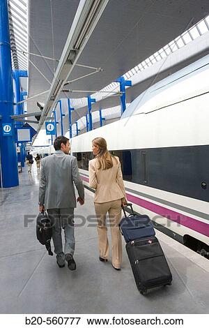 Businessmen. Passengers. AVE, Tren de Alta Velocidad. Train station. Lleida, Catalua. Spain. View Large Photo Image Stock Photo - Businessmen. Passengers. AVE, Tren de Alta Velocidad. Train station. Lleida, Catalua. Spain.. Fotosearch