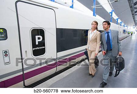 Businessmen. Passengers. AVE, Tren de Alta Velocidad. Train station. Lleida, Catalua. Spain. View Large Photo Image Stock Photo - Businessmen. Passengers. AVE, Tren de Alta Velocidad. Train station. Lleida, Catalua. Spain.. Fotosearch