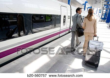 Businessmen. Passengers. Train station. Lleida, Catalua. Spain. View Large Photo Image Stock Photo - Businessmen. Passengers. Train station. Lleida, Catalua. Spain.. Fotosearch