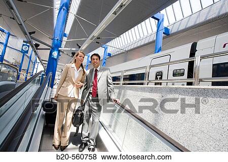 Businessmen. Passengers. Train station. Lleida, Catalua. Spain. View Large Photo Image Stock Photo - Businessmen. Passengers. Train station. Lleida, Catalua. Spain.. Fotosearch