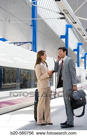 Businessmen. Passengers. Train station. Lleida, Catalua. Spain. View Large Photo Image Stock Photograph - Businessmen. Passengers. Train station. Lleida, Catalua. Spain.. Fotosearch
