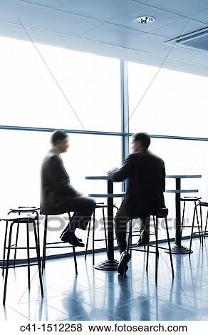 Businessmen resting in a bar View Large Photo Image Stock Photo - Businessmen resting in a bar. Fotosearch
