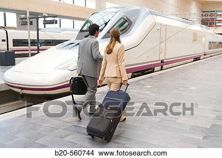 Businessmen. Travelers. AVE, Tren de Alta Velocidad. Delicias station, Zaragoza, Arag? n. Spain. View Large Photo Image Picture - Businessmen. Travelers. AVE, Tren de Alta Velocidad. Delicias station, Zaragoza, Arag? n. Spain.. Fotosearch